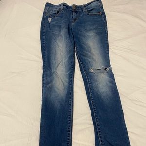 Faded distressed blue jeans